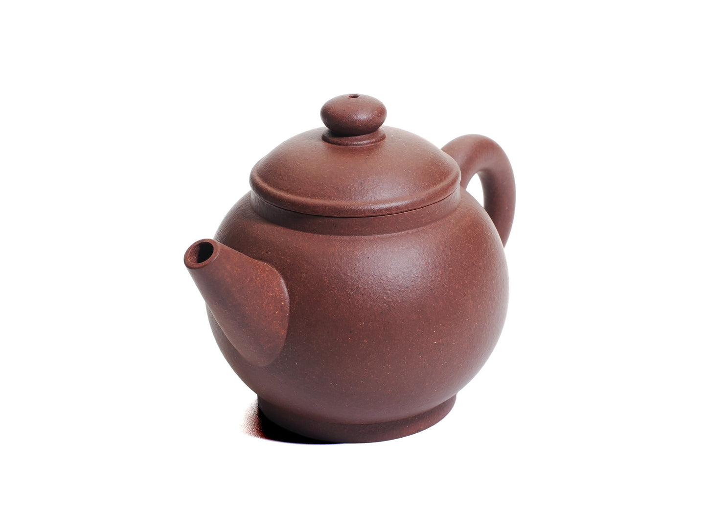 Angled top view of the Ju Lun Zhu teapot showcasing the short spout, domed lid and rounded body.