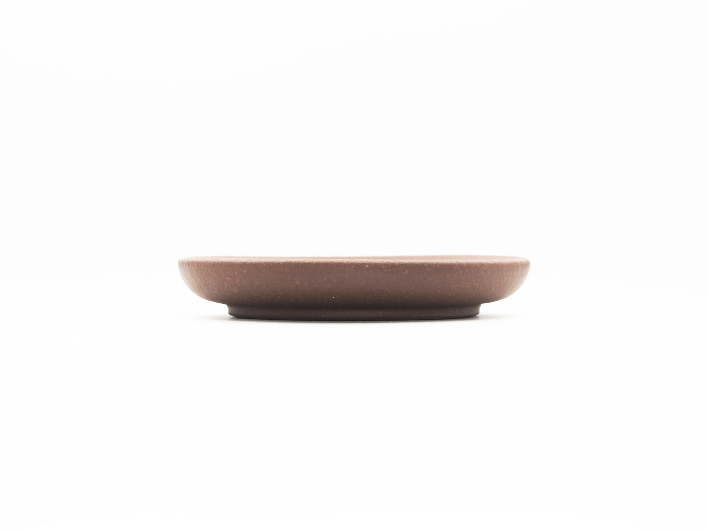 Side profile showing thickness and flat design of Dehou Yixing tea coaster