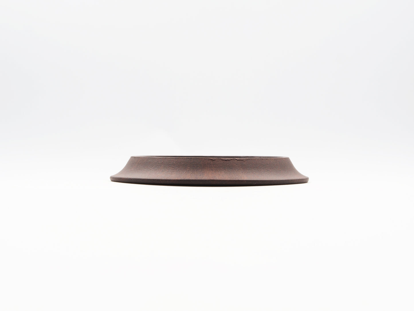 Side elevation of carved Yixing Tea Coaster made with Bronze Grade clay