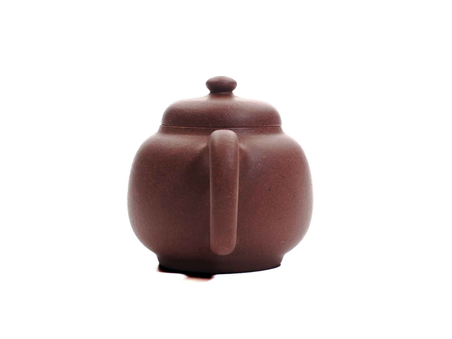 Back view of the Xiao Da Bin 50 ml diamond‑grade Yixing teapot showing the rounded handle and smooth purple clay finish.