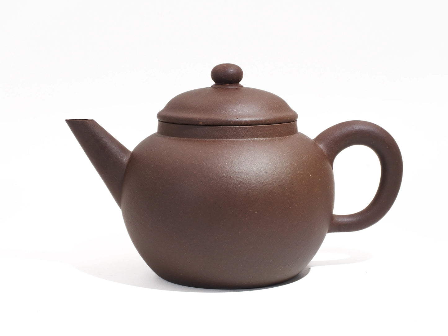 Side profile of the Bronze Grade Mo Yuan Zhai teapot, showcasing the rustic, matte Zisha clay texture unique to the 30th Anniversary set.