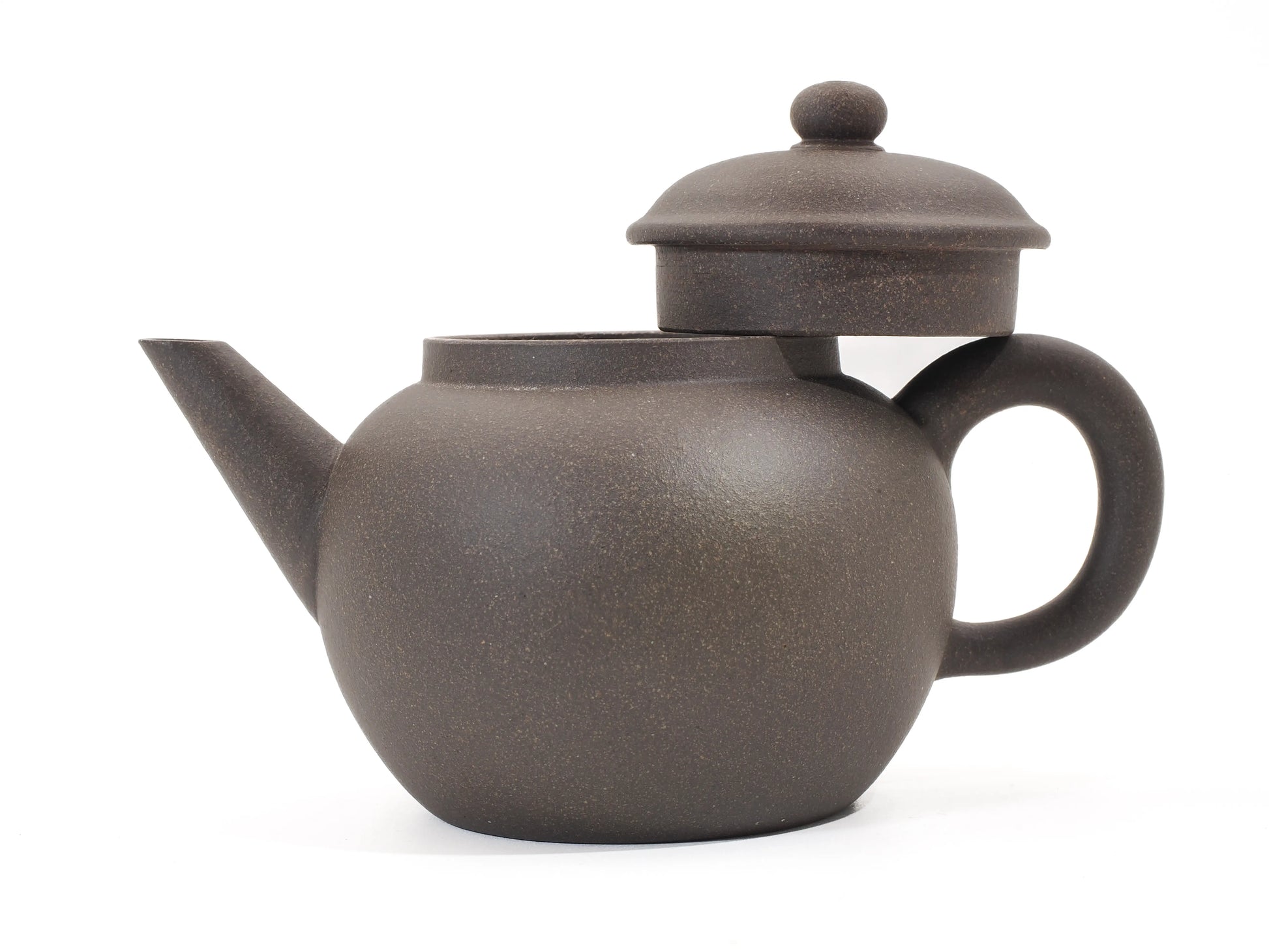 Gold Grade teapot with lid propped open, showing the precise fit and the granular texture of the Gold Grade clay.