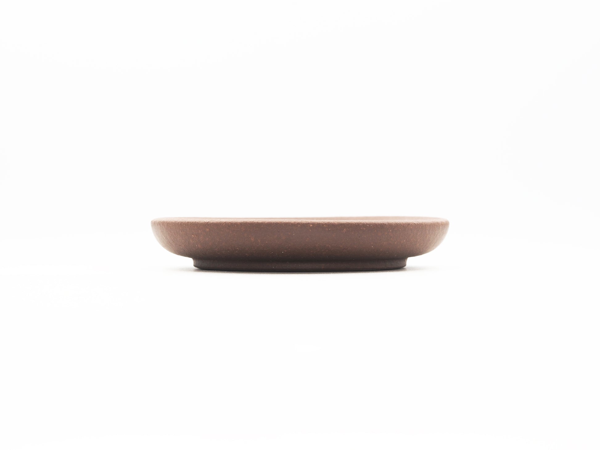 Side profile showing thickness and flat design of Dehou Yixing tea coaster