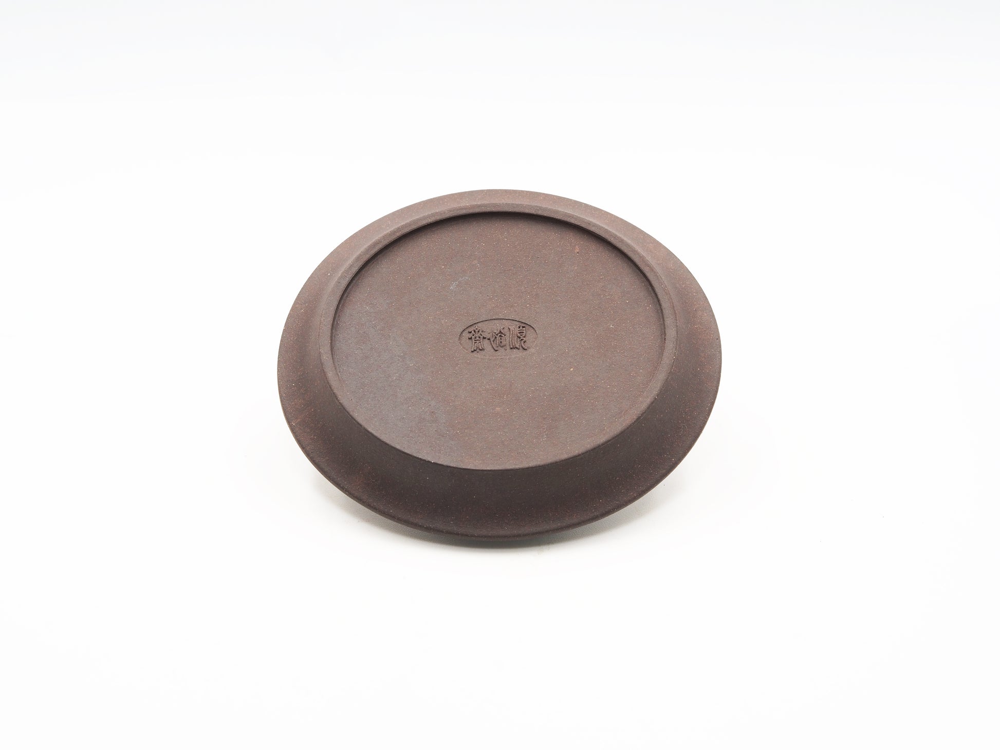 Angled base view showing bottom finish of the carved tea coaster