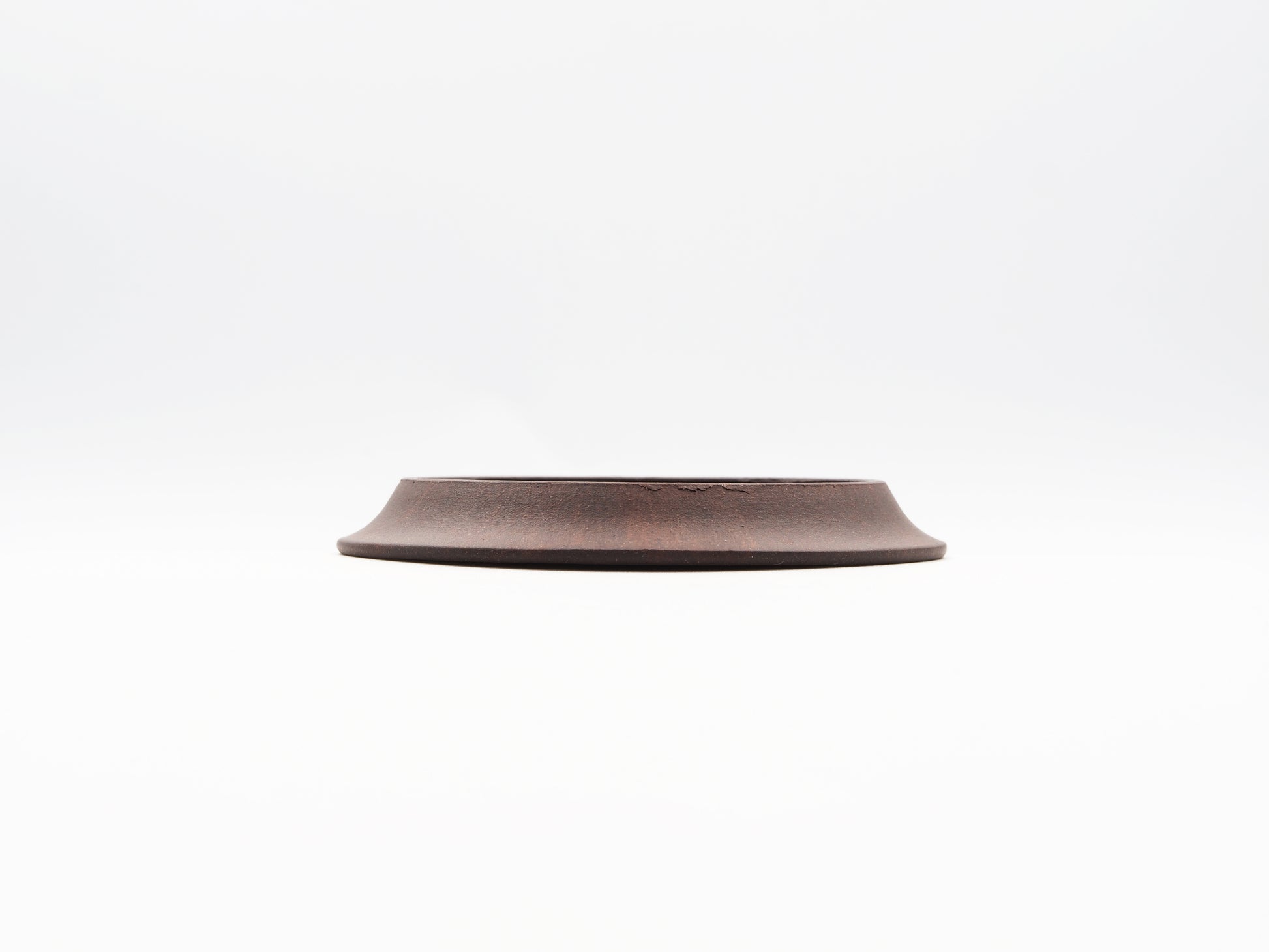 Side elevation of carved Yixing Tea Coaster made with Bronze Grade clay