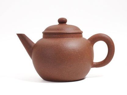 Side view of the Silver Grade Mo Yuan Zhai teapot, showing the balanced round body and the distinct "Silver Grade" Zisha clay texture.
